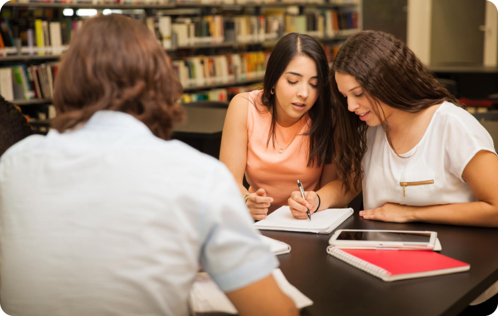 Students studying together at a library table