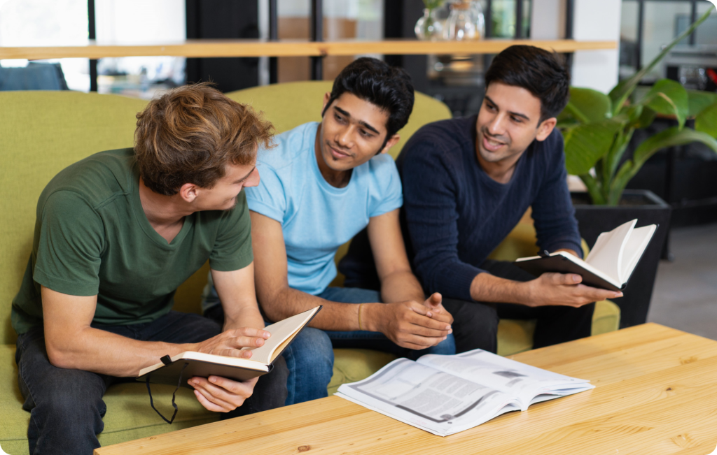 Group of students studying together on a sofa